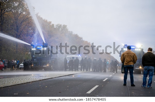 BERLIN, GERMANY\
18.11.2020. Demo in Berlin with the police and water cannons at the\
Victory Column against the Corona Covid-19 regulations and for\
human rights.