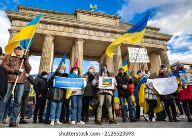 Berlin, Germany - 19 Feb 2022: Protest near Brandenburg Gate against Russian military threats of a big war against Ukraine. Hundreds of protesters declare solidarity with Ukraine    