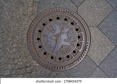 Berlin, Germany, 19.04.2020: Berliner Wasserbetriebe manhole cover as a featuring the most popular landmarks of Berlin, including tv tower, Memorial Church, Reichstag and the Brandenburg Gate