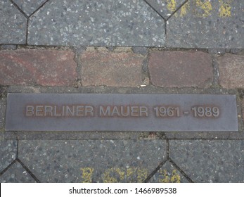 Berlin, Germany - 19th July 2018: Berlin Wall / Mauer Sign. Berlin Wall was a guarded concrete barrier that physically and ideologically divided Berlin from 1961 to 1989.