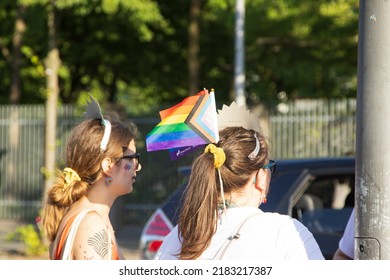 Berlin, Germany. 2022, July, 23. A Girl Wearing A Rainbow Flag On The Head During The Berlin Pride Parade.