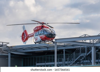 Berlin, Germany 26.02.2020: red helicopter on the roof of a accident hospital in berlin, the helicopter is prepared for ambulance and emergency services