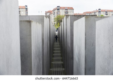 Berlin, Germany - April 12, 2017: Girl Walking In The Memorial To The Murdered Jews Of Europe, Also Known As The Holocaust Memorial (German: Holocaust-Mahnmal) In Berlin, Germany