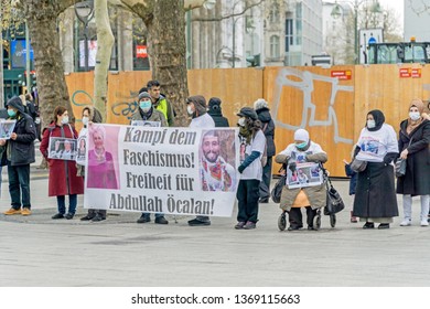 BERLIN, GERMANY APRIL 13, 2019: A Group Of Peaceful Silent Protestors Demonstrating In Berlin With A Banner Showing A Picture Of Abdullah Öcalan