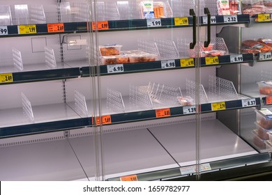 Berlin, Germany April 29, 2020: Meat And Sausage In The Grocery Store.  Empty Shelves In A Supermarket. Customers Buy Groceries And Other Items On Stock. Empty Shops, Panic Shopping