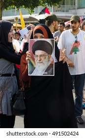 BERLIN, GERMANY - AUGUST 03, 2013: International Quds Day. Demonstrators On The Kurfuerstendamm. Participants With A Portrait Of Current Supreme Leader Of Iran - Ali Khamenei.