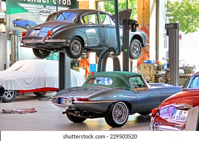 BERLIN, GERMANY - AUGUST 12, 2014: British classic cars Jaguar in the workshop of the museum of vintage cars Classic Remise.