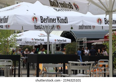 Berlin, Germany. August, 2022. Terrace Bar With Berliner Kindl Pilsener Beer Umbrellas In Downtown