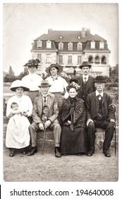 BERLIN, GERMANY - CIRCA 1900: Old Photography Of A Wealthy Family With His House On Background. Antique Picture With Original Film Grain