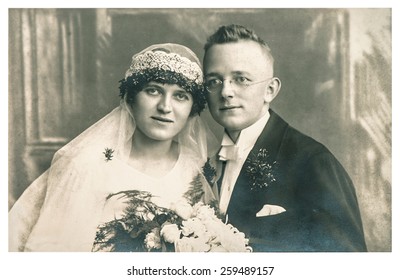 BERLIN, GERMANY - CIRCA 1935: Original Antique Wedding Photo. Portrait Of Just Married Couple. Vintage Picture With Original Film Grain And Blur