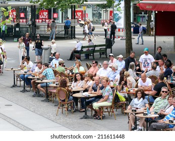 BERLIN, GERMANY, CIRCA 2013 - Tourists and Berlin citizens sit in the summer cafe circa 2013 in Berlin, Germany