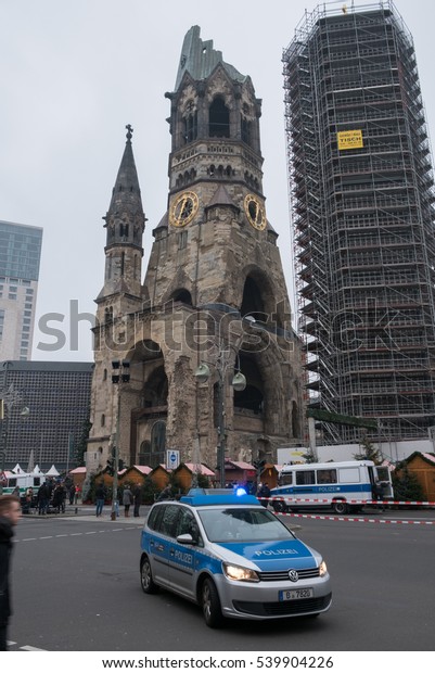 Berlin, Germany - december 20, 2016: Police car\
at the memorial church / Christmas Market in Berlin, the day after\
the terrorist attack.\
