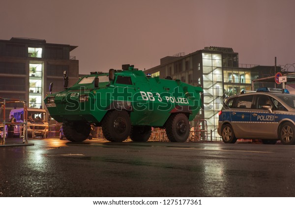 BERLIN,\
GERMANY - DECEMBER 31, 2018: Street blocked by the police armored\
vehicle during New Year Eve  celebrations.\
