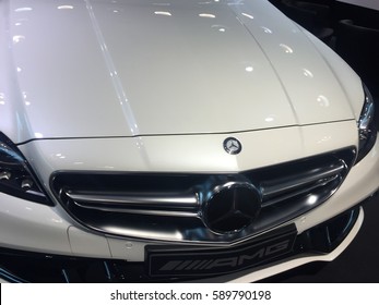 Berlin, Germany - February 27, 2017: Mercedes Benz Logo On White Car. Front View. Mercedes Benz Is A German Manufacturer Of High End Cars, Headquartered In Stuttgart