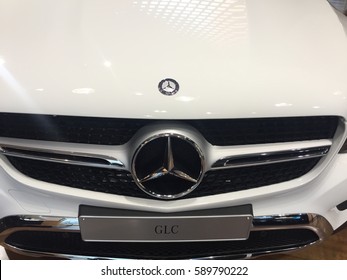 Berlin, Germany - February 27, 2017: Mercedes Benz Logo On White Car. Front View. Mercedes Benz Is A German Manufacturer Of High End Cars, Headquartered In Stuttgart