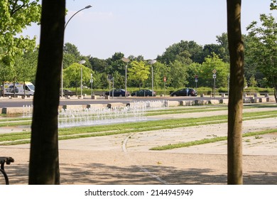 Berlin, Germany - Jul 2010: Water Fountain Garden Open For Public In The Street In Summer With Trees And Blue Sky Background. No People.