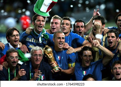 Berlin, GERMANY - July 09, 2006: 
Fabio Cannavaro holds the trophy and celebrates with  head coach Marcello Lippi 
during the 2006 FIFA World Cup Germany Final  
Italy v France at the Olympiastadion.