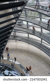 Berlin, Germany - July 2010: Interior Of The Reichstag Glass Dome With People Walking On Spiral Walkway. Popular Tourist Attraction In Berlin.