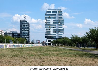 Berlin, Germany, July 29, 2022, View Over The Park At The River Spree To The Building Of OSF Digital Germany GmbH With The Daimler AG Office In The Background.