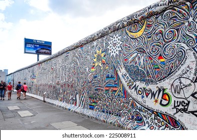 BERLIN, GERMANY- JULY 31, 2014: Berlin Wall was a barrier constructed starting on 13 August 1961. East Side Gallery is an international memorial for freedom. JULY 31, 2014 in Berlin 