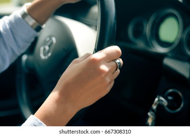 Berlin, Germany - June 24 2017: Closeup On Female Hands Driving Mercedes Benz Car Luxury Transportation Lifestyle