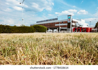 Berlin, Germany - June 27, 2020: Schönefeld Airport Terminal Building Seen Behind Dried Grass On A Summer Day. 