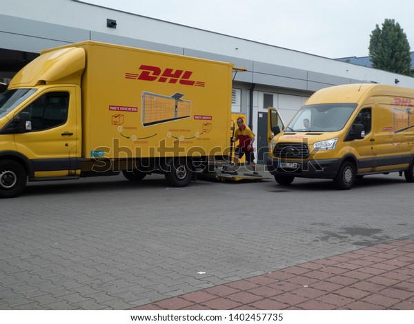 Berlin, Germany - June 5, 2018: DHL delivery van.\
Dhl is global market leader in logistics industry. It commits its\
expertise in international parcel, express, air and ocean freight,\
road and rail