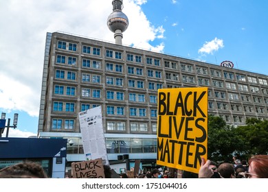 Berlin, Germany - June 6, 2020: Protestors Hold Up A 