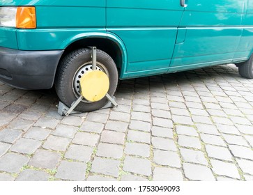 Berlin, Germany - June 8, 2020: Wheel Clamp Or Denver Boot, Device Preventing Motor Vehicles From Being Moved