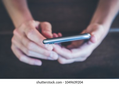 Berlin, Germany - March 2018: Closeup Of Woman Hand Holding IPhone 6 Silver. IPhone 6 Was Created And Developed By The Apple Inc