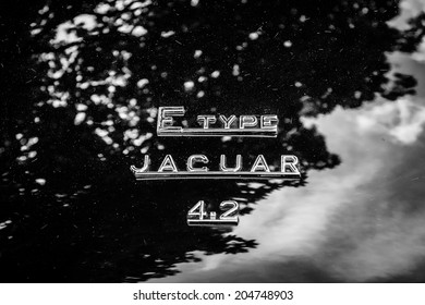 BERLIN, GERMANY - MAY 17, 2014: The emblem on the trunk of the sports car Jaguar E-Type 4.2. Black and white. 27th Oldtimer Day Berlin - Brandenburg 