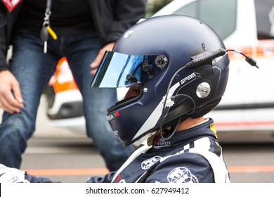 Berlin, Germany - May 20, 2016: Profile Portrait Of Unrecognizable Pilot Of FIA Formula E Racing Car Championship With Full Helmet. FIA Is A Class Of Auto Racing Using Only Fully Electric-powered Cars