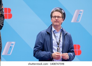 Berlin, Germany - May 25, 2019: Federal Minister of Transport and Digital Infrastructure Andreas Scheuer on the podium at the E-Prix ABB FIA Formula E race car Championship Award Ceremony
