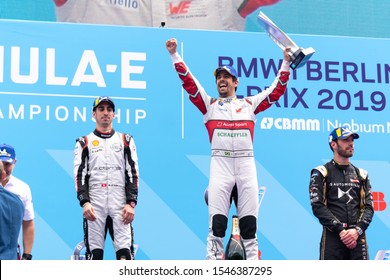 Berlin, Germany - May 25, 2019: Racing Driver Lucas Di Grassi On The Podium At The E-Prix ABB FIA Formula E Race Car Championship Award Ceremony. Second And Third Are Sébastien Buemi Jean-Éric Vergne