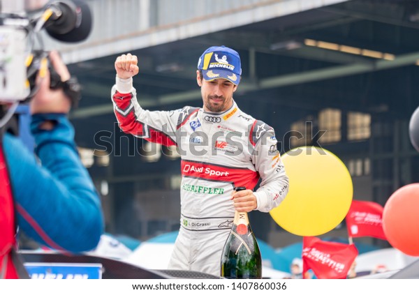 Berlin,\
Germany - May 25, 2019: Brazilian professional racing driver Lucas\
Tucci di Grassi exulting on the podium at the E-Prix ABB FIA\
Formula E race car Championship Award\
Ceremony