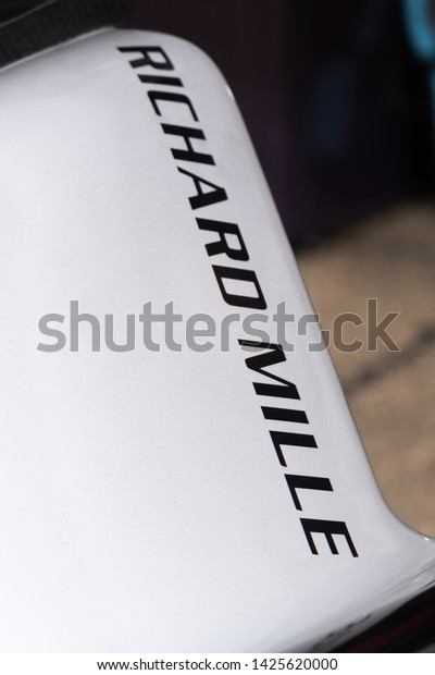 Berlin, Germany - May 25,\
2019: Swiss watchmaking brand Richard Mille sponsor banner on a\
race car participating in the ABB FIA Formula E street racing\
Championship