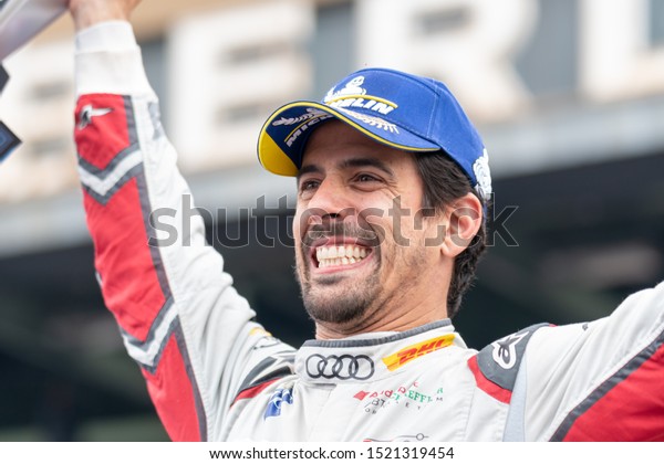 Berlin,\
Germany - May 25, 2019: Brazilian professional racing driver Lucas\
Tucci di Grassi exulting on the podium at the E-Prix ABB FIA\
Formula E race car Championship Award\
Ceremony