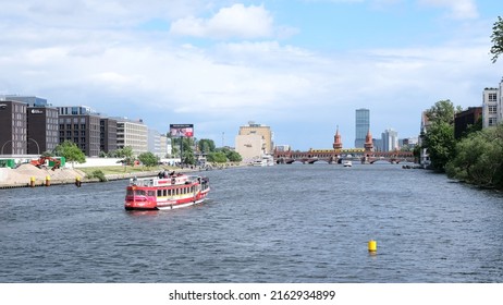 Berlin, Germany, May 28, 2022, View Over The River Spree Towards Oberbaumbrücke With The Treptower In The Background