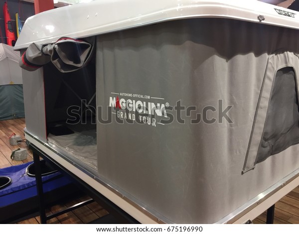 Berlin, Germany - May 6, 2017: Maggiolina Grand\
Tour roof tent for sale in shop. A roof tent is an accessory which\
may be fitted to the roof of a motor vehicle allowing to sleep in\
safety and comfort