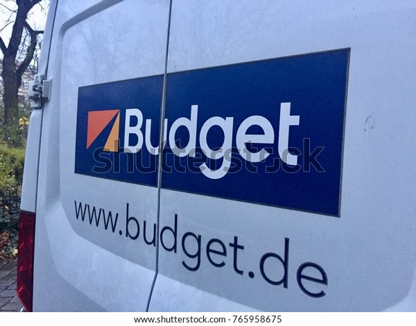 Berlin, Germany - November 21, 2017: Budget car\
rental advertisement on van. Budget Rent A Car was founded in 1958\
as a car rental company. Today it has nearly 1,800 rental locations\
worldwide