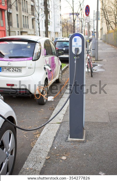BERLIN, GERMANY - NOVEMBER 23 2015: An electric\
car being charged on a\
street.