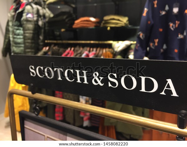 Berlin, Germany - October 11, 2018: Scotch &\
Soda sign. Dutch fashion retail company, Scotch and Soda primarily\
manufactures premium and upmarket men\'s, women\'s, boy\'s, girls\'\
clothing, and denim