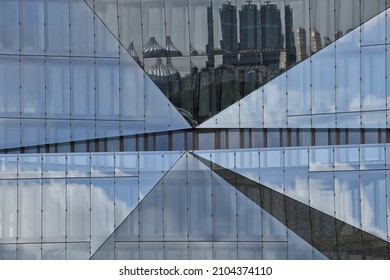 Berlin, Germany – September 04, 2021: Reflection on a glass window facade, 3XN Cube building, Government district, Tiergarten, Berlin, Germany