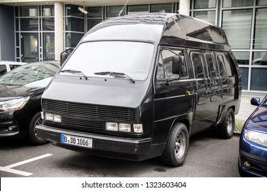 Berlin, Germany - September 12, 2013: Black Tuned Passenger Van Volkswagen Transporter In The City Street.