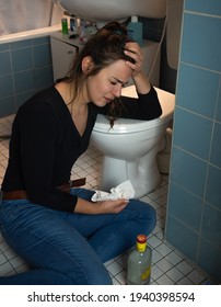 Berlin, Germany - September 13, 2020: A 29 Year Old Woman Is Being Sad And Frustrated In Her Bathroom, Drinking Alcohol From The Bottle.