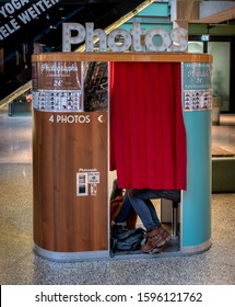 Berlin; Germany, September, 21, 2019, Teenagers Are Sitting In A Retro Photo Machine For Passport Photos
