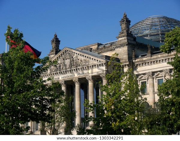 Berlin, Germany.July 2018 This view of the\
Reichstag was taken from the River Spree . The dome on top was\
designed by British Architect Norman Foster in 1992 and it is here\
the Bundestag meets