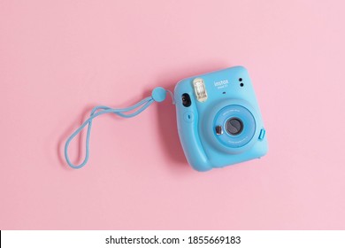 BERLIN, GRMANY - OCTOBER 19, 2020: The Pink Fujifilm Instax Mini 11 Instant Camera On Background. High Quality Photo