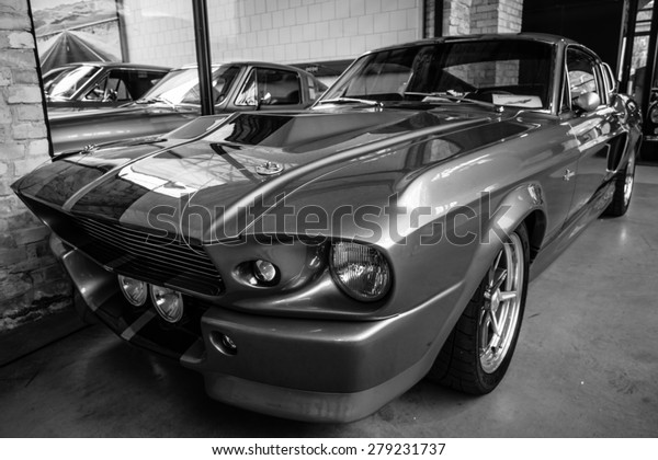 BERLIN - MAY 10,\
2015: Shelby GT 500E Super Snake, 1968. Black and white. The Shelby\
is a higher performance variant of the Ford Mustang. 28th\
Berlin-Brandenburg Oldtimer\
Day