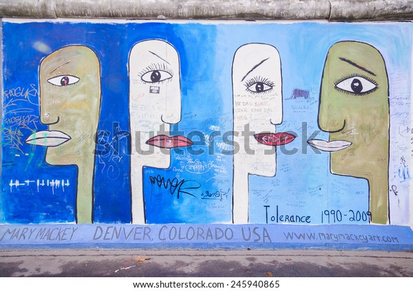BERLIN - NOVEMBER 11: Fragment of East Side\
Gallery on November 11,2014 in Berlin. It\'s a 1.3 km long part of\
original Berlin Wall which collapsed in 1989 and now is the largest\
world graffiti gallery